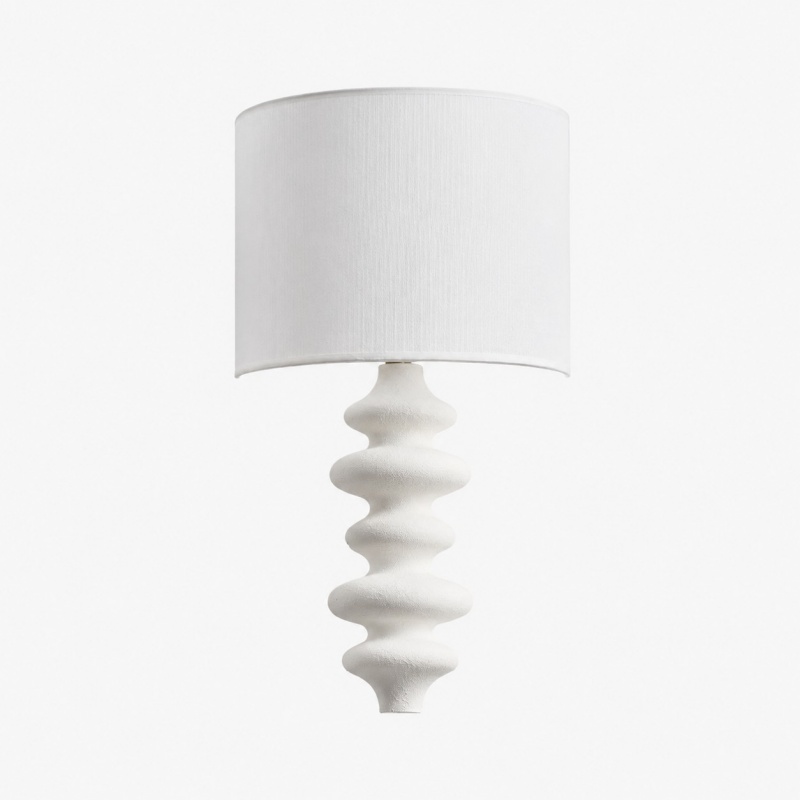 White sculptural wall lamp with white fabric shade