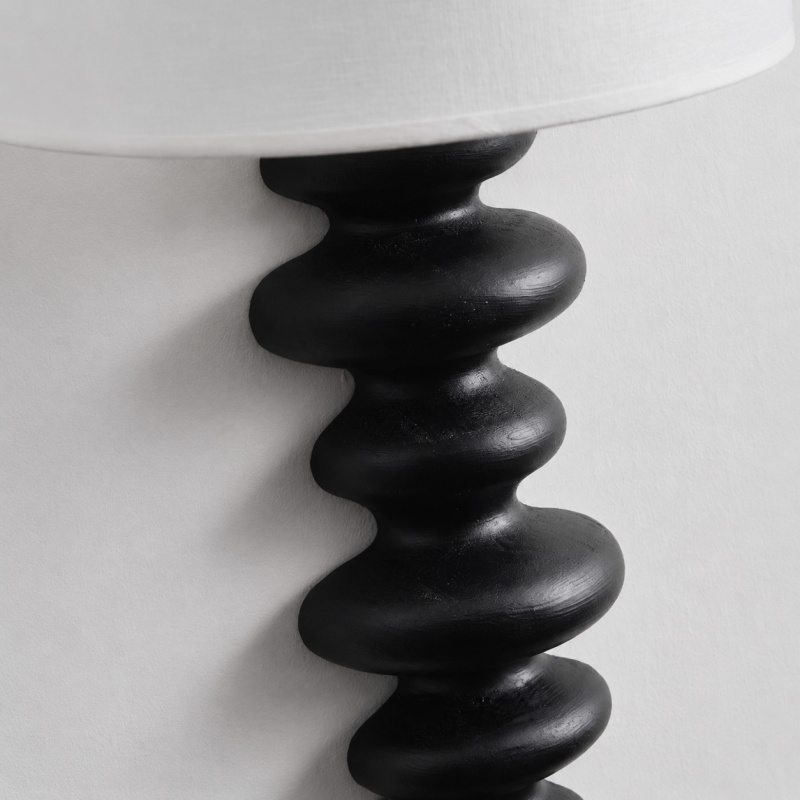 Ebony carved wood wall lamp detail